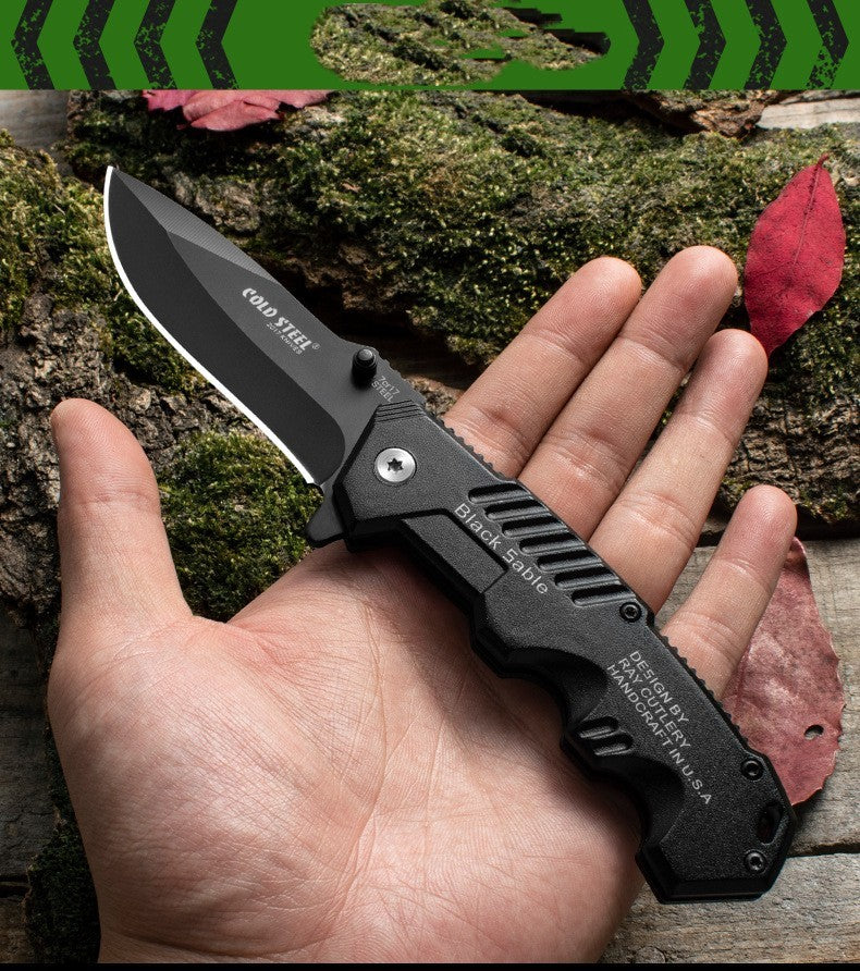 7Cr17 Mov Stainless Steel Folding Knife with Black Aluminum Handle in Hand