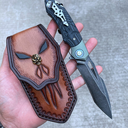 High-quality D2 steel survival folding knife with G10 handle and leather sheath, showcasing blade and intricate leatherwork.