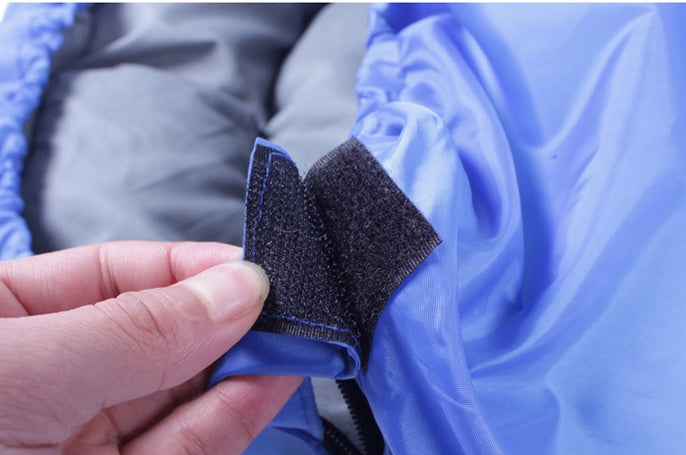 Velcro feature on portable waterproof sleeping bag for preventing zipper slip