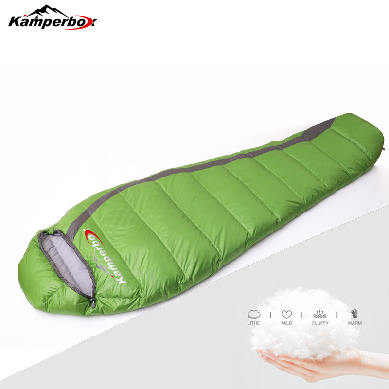 Green Kamperbox down sleeping bag with soft fill, ideal for cold weather camping.