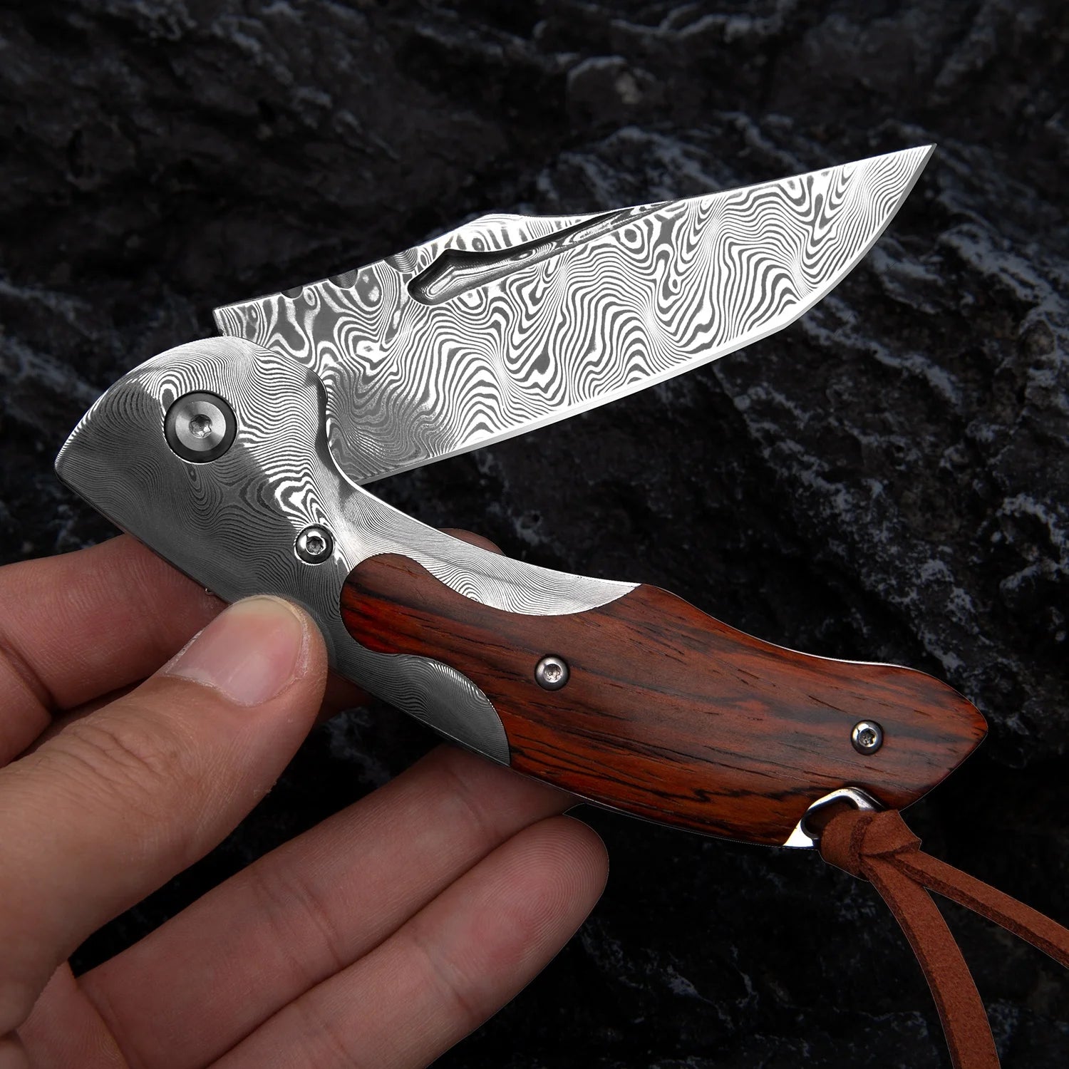 Close-up of Handmade Damascus Steel Knife with Rosewood Handle and Leather Sheath