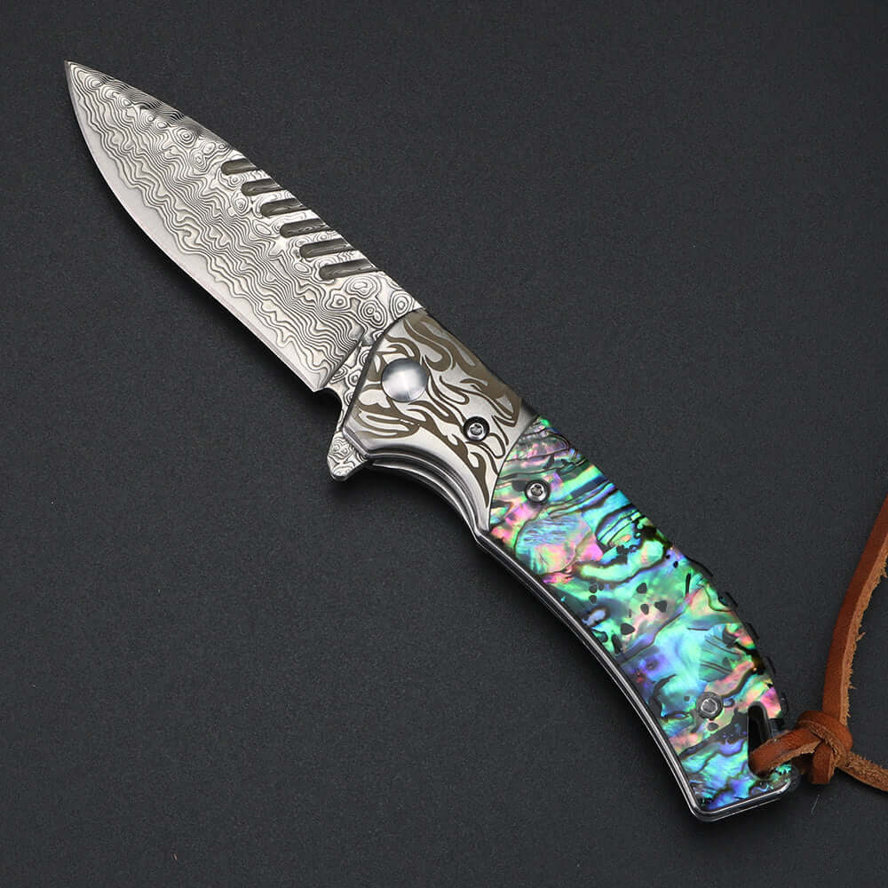 Damascus sandwich steel folding knife with intricate blade pattern and colorful handle, accompanied by a leather case.